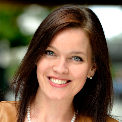 Kerri Kirincic Headshot of Kerri Kirincic, a smiling woman with dark brown hair and light eyes wearing a yellowish top and pearl necklace